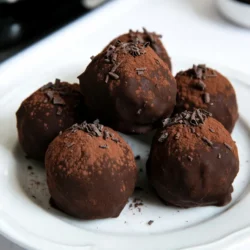 - 8 oz dark chocolate, chopped - 1/2 cup heavy cream - 1 tablespoon instant espresso powder - 1 teaspoon vanilla extract - 1/4 teaspoon salt - 1/2 cup powdered sugar To make Irish Cream Espresso Truffles, you need a few key ingredients. First, dark chocolate adds depth. I recommend using good quality chocolate for the best taste. Next, heavy cream gives a rich and smooth texture. Instant espresso powder boosts the coffee flavor. Vanilla extract adds a sweet note. A pinch of salt balances the sweetness. Lastly, powdered sugar helps sweeten the truffles. - Cocoa powder - Shaved chocolate - Chocolate sprinkles For a fun twist, you can coat your truffles. Cocoa powder gives a classic finish. Shaved chocolate adds elegance. Chocolate sprinkles bring a festive touch. These options make your truffles not just tasty, but also visually appealing! {{ingredient_image_1}} 1. Heating the cream: Start by pouring the heavy cream into a small saucepan. Heat it over medium heat. Watch closely until it steams. Don’t let it boil. 2. Adding espresso powder: Once the cream is hot, stir in the instant espresso powder. Mix well until it fully dissolves. This adds a rich coffee flavor. 3. Incorporating dark chocolate, vanilla, and salt: Remove the pan from heat. Add the chopped dark chocolate, vanilla extract, and salt. Stir until everything melts together. You want a smooth and shiny mixture. 1. Cooling the ganache: Pour the ganache into a bowl. Let it cool to room temperature. Once cool, cover it with plastic wrap. Place it in the fridge for about two hours. You want it firm enough to scoop. 2. Scooping and rolling the truffles: After chilling, use a melon baller or your hands, dusted with cocoa powder, to scoop small portions. Roll each portion into a ball. Aim for a uniform size for even bites. 1. Coating in cocoa powder or sprinkles: Roll each truffle in cocoa powder until fully coated. For a fun twist, try rolling some in chocolate sprinkles or adding shaved chocolate on top. 2. Refrigerating for firming: Place the truffles on a parchment-lined tray. Refrigerate them for another 30 minutes. This helps them firm up before you serve. Enjoy your delicious Irish Cream Espresso Truffles! To make a smooth ganache, control the temperature when heating the cream. Heat the heavy cream over medium heat until it steams but does not boil. Boiling can change the texture and taste. Once you add the espresso powder, mix it well. This ensures that the espresso blends fully with the cream. Then, when you add the dark chocolate, vanilla, and salt, stir until everything melts. A smooth mixture is key for great truffles. When rolling the truffles, dust your hands with cocoa powder. This prevents the chocolate from sticking to your fingers. It also adds a nice touch to the truffles. Aim for size consistency when forming the truffles. Each one should be about the same size. This way, everyone enjoys even bites. Use a melon baller or your hands to scoop and roll. For presentation, serve your truffles in a decorative box or on a pretty platter. You can garnish them with a light dusting of cocoa powder. A sprig of mint adds a fresh look. Pair these truffles with coffee or a sweet dessert wine. The flavors complement each other well. Enjoy these treats at a gathering or as a special gift! Pro Tips Quality Chocolate Matters: Use high-quality dark chocolate for a richer flavor and smoother texture in your truffles. Chill Before Rolling: Ensure the chocolate mixture is fully chilled before rolling to prevent melting and maintain shape. Experiment with Coatings: Try rolling your truffles in crushed nuts, coconut, or flavored cocoa powder for unique variations. Serving Suggestions: Pair these truffles with a strong coffee or dessert wine for an indulgent treat. {{image_2}} You can make Irish Cream Espresso Truffles even better with some fun flavors. Adding liqueurs like Irish whiskey or coffee liqueur gives a deeper taste. You can also try infusing your truffles with orange zest for a bright twist. Just mix a little zest into the ganache. This adds a fresh and zesty flavor that pairs well with chocolate. Instead of just cocoa powder, you can coat your truffles in different ways. Dipping them in tempered chocolate creates a smooth and shiny finish. You can also roll your truffles in crushed nuts or coconut flakes for a crunchy texture. Both options add a new layer of flavor and fun. When serving your truffles, think about how to make them stand out. You can include them in a dessert platter for a sweet treat spread. For gift ideas, pack them in a cute box or jar. Adding a ribbon makes a lovely touch. These simple changes make your truffles even more special for friends and family. To keep your Irish Cream Espresso Truffles fresh, store them in the fridge. Place them in an airtight container. This helps prevent any unwanted smells from affecting their taste. Keep the truffles away from strong-flavored items. To maintain their texture, let them sit at room temperature for a few minutes before serving. This allows them to soften slightly and enhances the chocolate flavor. Avoid storing them in the door of the fridge, as the temperature can vary too much. These truffles last about one week in the fridge. After that, they may lose their best flavor and texture. Watch for signs of spoilage. If you see any mold or the chocolate appears dull and dry, it’s time to toss them. Keep in mind that the fresher they are, the better they taste. Enjoy these delightful treats within that week for the best experience! It takes about 20 minutes to prepare the truffles. Then, you need to chill them for about 2 hours. This gives the mixture time to firm up. Finally, let them chill for another 30 minutes after rolling. In total, expect to spend around 2 hours and 50 minutes from start to finish. Yes, you can freeze the truffles! First, place them on a tray and freeze them for about an hour. This helps them hold their shape. After that, transfer them to an airtight container or a freezer bag. They can stay frozen for up to 2 months. To enjoy them, thaw them in the fridge overnight before serving. I recommend using dark chocolate for the best flavor. It gives the truffles a rich taste that pairs well with espresso. If you prefer a sweeter option, you can use milk chocolate. For a lighter touch, white chocolate works too, but it will change the flavor profile. Choose good-quality chocolate for the best results. Irish Cream Espresso Truffles are fun to make and enjoy. You learned the ingredients, steps, and tips for perfect truffles. I also shared storage details and fun variations to try. Putting a twist on this treat can lead to even more delicious flavors. Whether for yourself or as gifts, these truffles are a sweet delight. So grab your ingredients, get started, and savor every bite!